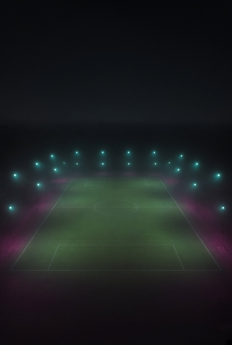 Physical lattice lights fading over an empty fictional field
